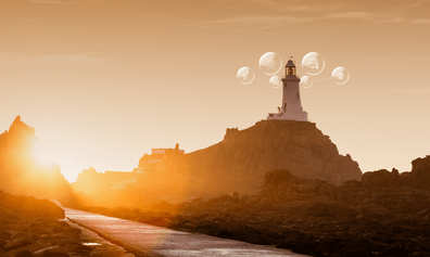 Jersey landmark Corbiere lighthouse at sunset