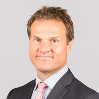 Head shot of James Campbell in a suit and tie