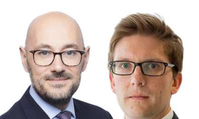 a head shot of two men in suits