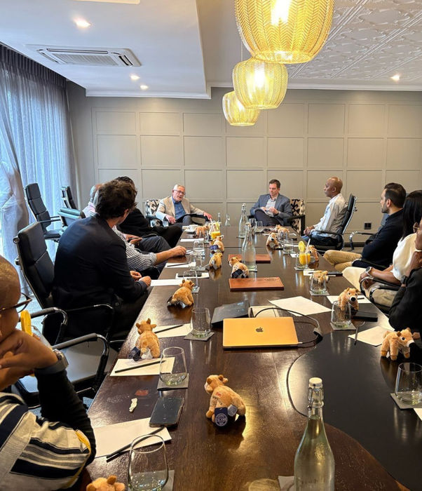 Group of people sitting at a roundtable event