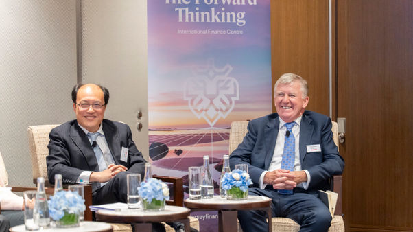 Mr Wen Tan, Head of Strategy at Nelson Capital, and Joe Moynihan, Chief Executive Officer of Jersey Finance smiling at the panel discussion.