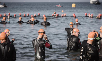 Accuro Jersey Triathlon participants wading into the sea