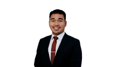 Image of Danilor Flores in a business suit with tie