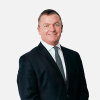 Portrait of Peter in formal business attire