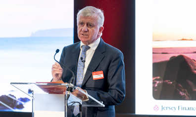 Joe Moynihan at a podium speaking at our Global Horizons event