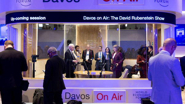 Rachel Reeves and others in a podcast recording booth at the World Economic Forum in Davos 2026