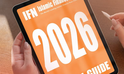 Two hands holding a device with an image of the IFN report cover displayed.