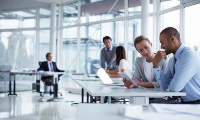 Professionals reviewing documents in a modern office