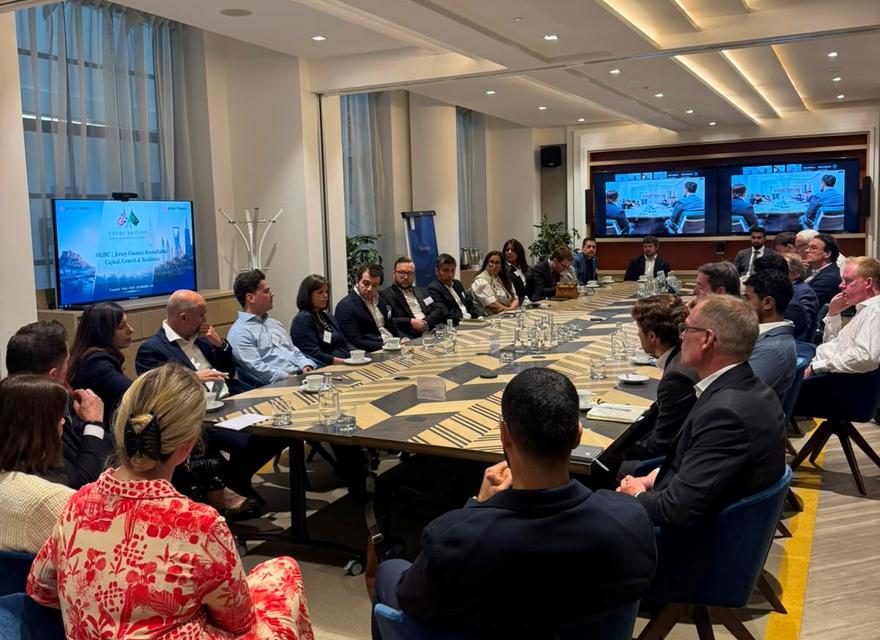 A boardroom table surrounded by business people