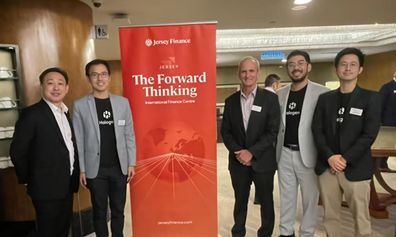 Photo of Yiow and speakers from the event